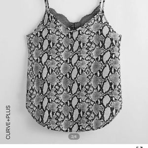 Sleeveless blouse with lace along neckline